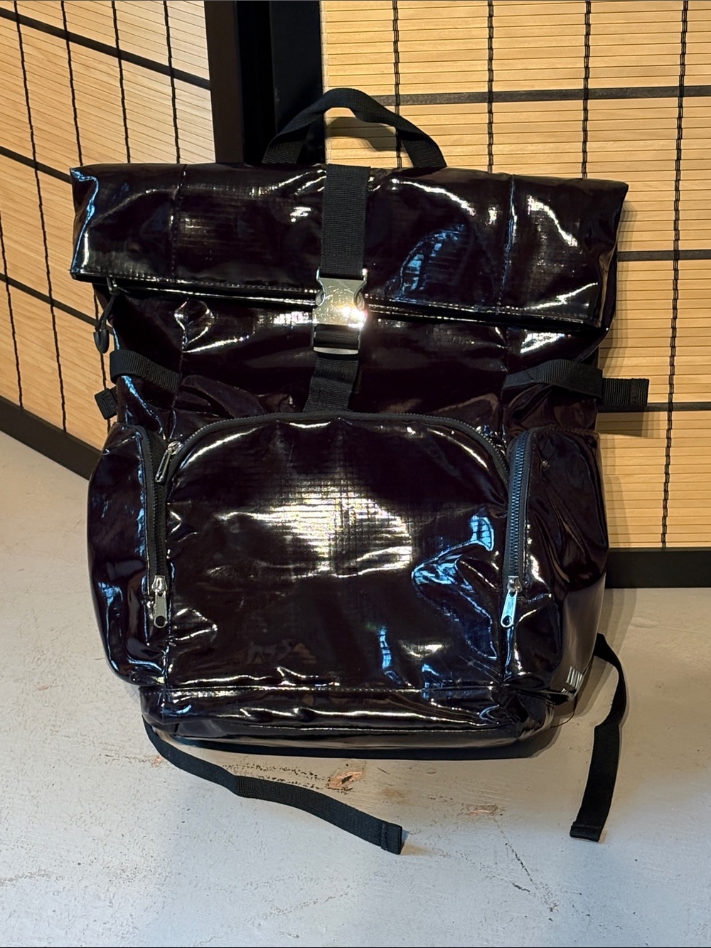 Isaac Mizrahi black patent leather rolltop backpack. IMNYC